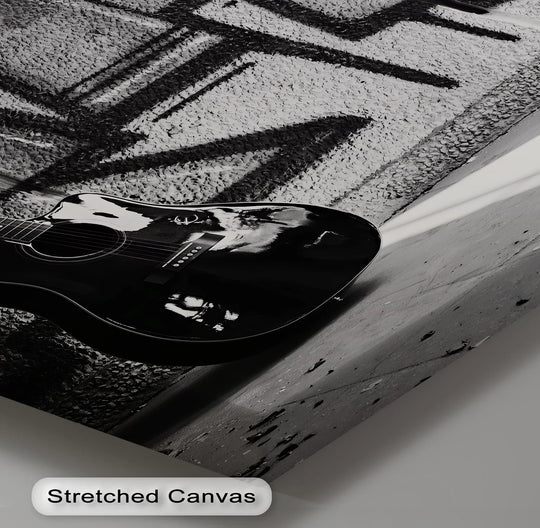 Subtle gradations highlight the textural contrast between the black guitar and gray graffiti in this urban-style best canvas prints of 'Urban Contrast Guitar Art'.