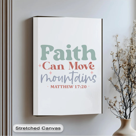 Showing a striking color contrast, the pastel 'Faith Can Move Mountains' canvas wall decor features sage green, coral, and lilac typography on a clean white stretched canvas.
