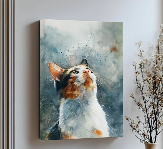 Airy negative space surrounds a calico cat looking up in a watercolor light from this cat canvas print, emphasizing the subject through the use of big canvas prints.