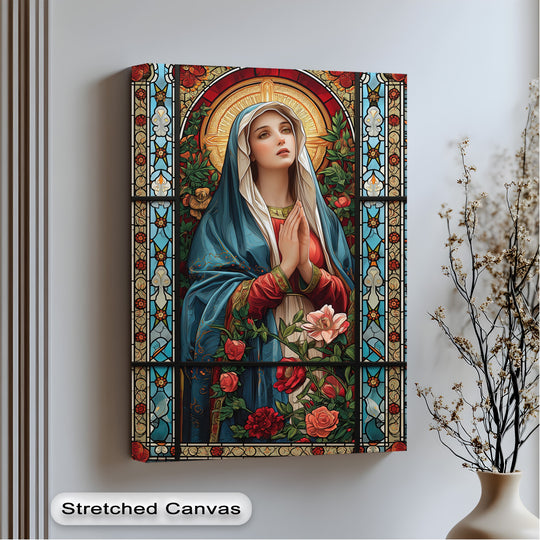 A vertically oriented rectangular canvas wall art features a religious stained glass style image of Mary, adorned with detailed floral elements.
