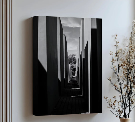 Framed by the architectural corridor, the tree becomes a serene canvas wall decor element within the black and white Infinite Path canvas print.