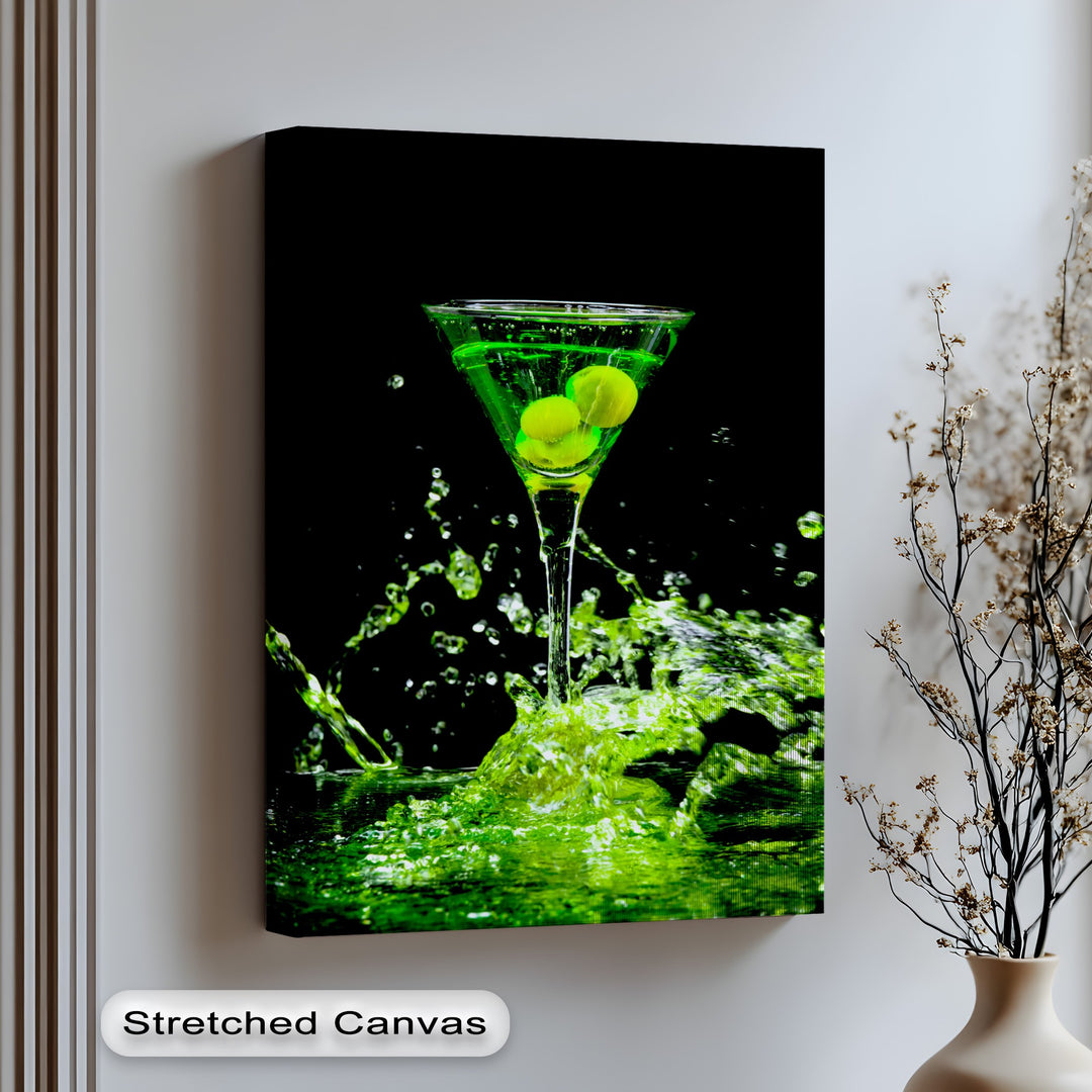 A vertically oriented, rectangular unique canvas print displays a vibrant neon green martini cocktail with dramatic splashes.