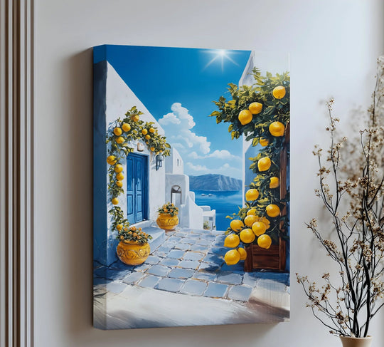 Textured surface of this Santorini Mediterranean street canvas print showcases the details of the big canvas prints, lemons, white walls, and blue cobblestone path.