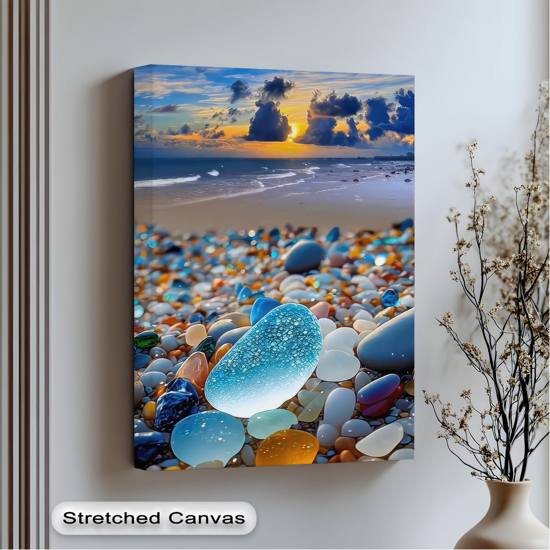 Stillness descends upon the vibrant coastal sunset, where tranquil ocean waters meet colorful sea glass pebbles, a captivating premium canvas decor.