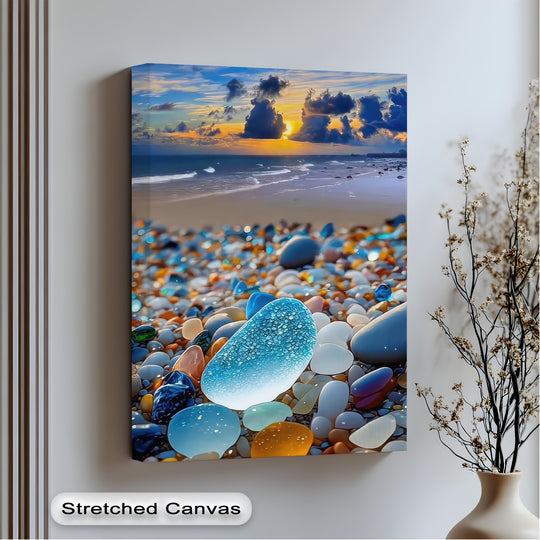 Stillness descends upon the vibrant coastal sunset, where tranquil ocean waters meet colorful sea glass pebbles, a captivating premium canvas decor.