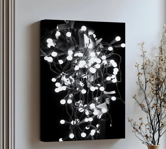 Examining the realistic detail, this canvas art prints showcase a photographic-style abstract black and white light canvas featuring a luminous tangle of glowing bulbs.
