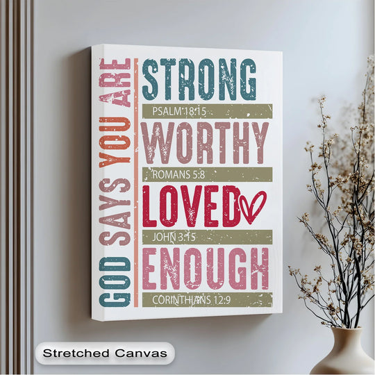 Scripture-themed central subject displaying a 'God Says You Are' canvas painting alongside encouraging affirmations: strong, worthy, loved, and enough.