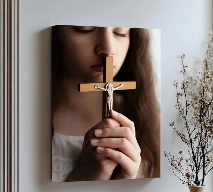 Faithful Prayer – Girl Holding Crucifix Close-Up Canvas Print