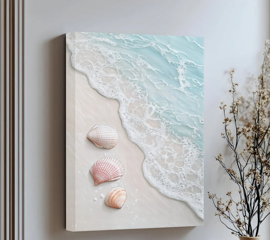 Strong color contrast highlights the foamy white surf against the pale sand and delicate seashells on this peaceful coastal-themed canvas art.