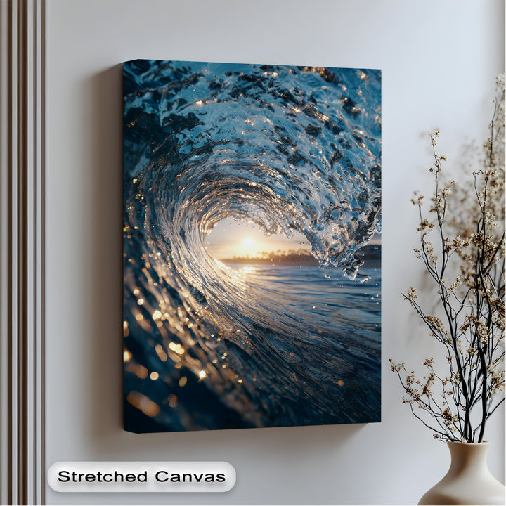 A portrait canvas art print features a mesmerizing, tunnel-shaped ocean wave shimmering with golden sunset reflections.
