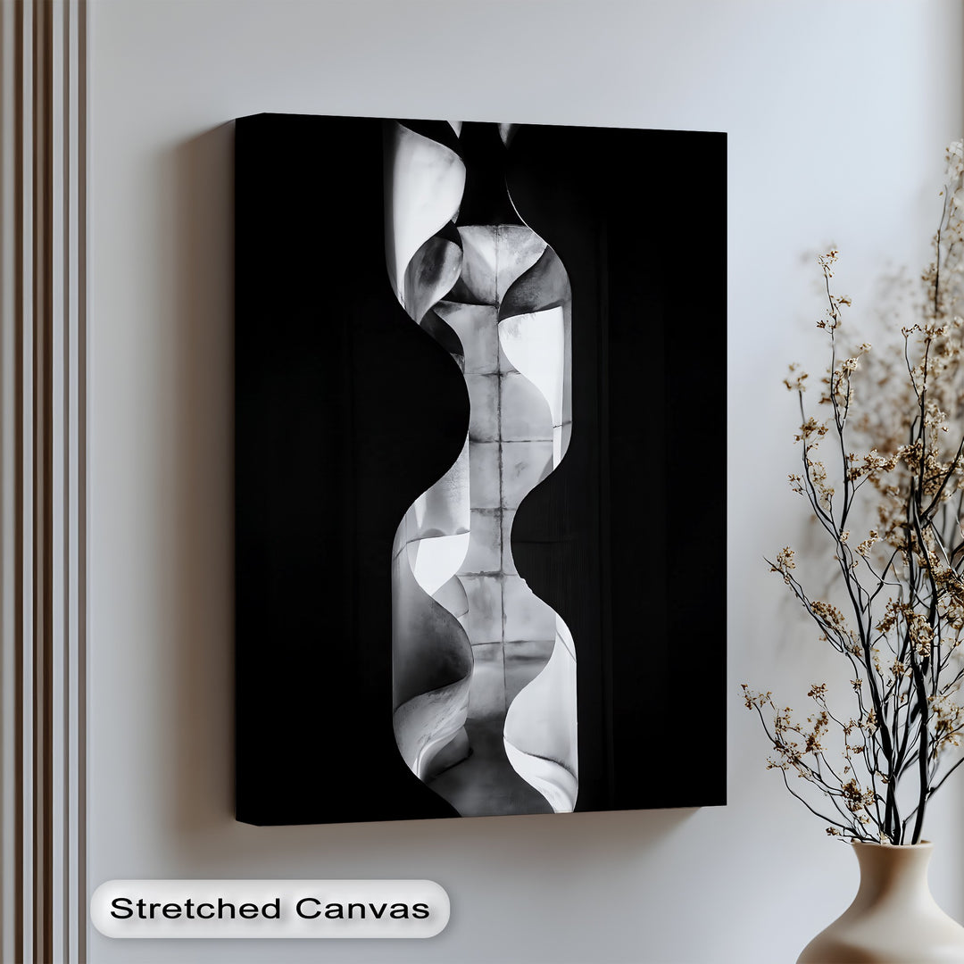 Elevate your decor with this sculptural canvas wall art featuring fluid curves and industrial texture.

