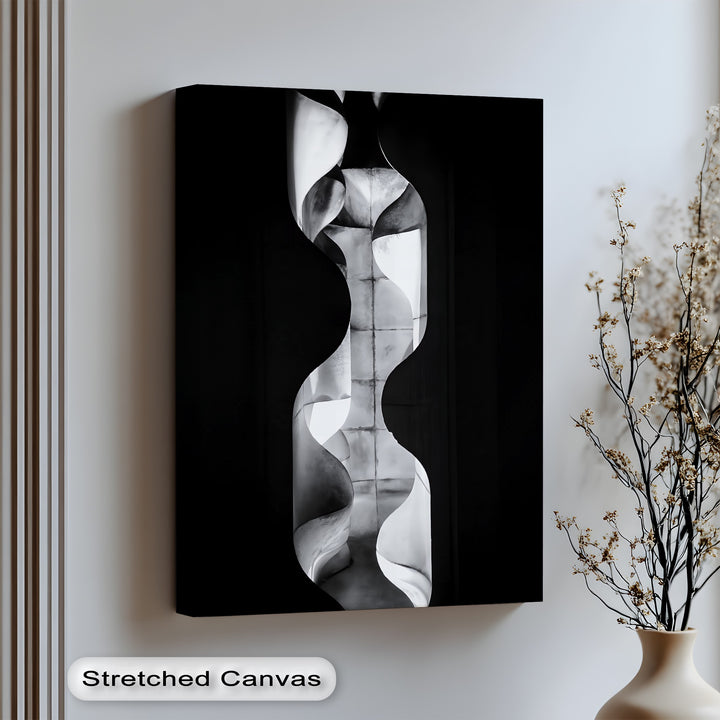 Elevate your decor with this sculptural canvas wall art featuring fluid curves and industrial texture.

