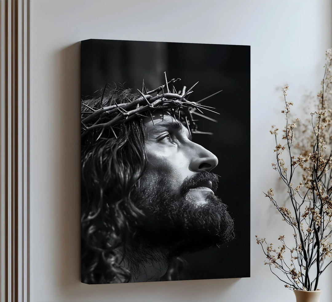 Gaze upon divine sacrifice with this intense canvas wall art of Christ crowned with thorns.

