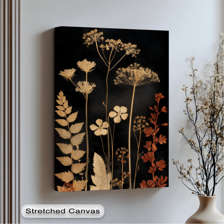 Golden-hued organic forms of botanical silhouettes create a striking contrast on this elegant, dark floral nature big canvas prints wall art.