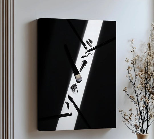 Negative space highlights the makeup brushes in a monochrome palette, creating a modern art aesthetic for big canvas prints featuring bold strokes of light.