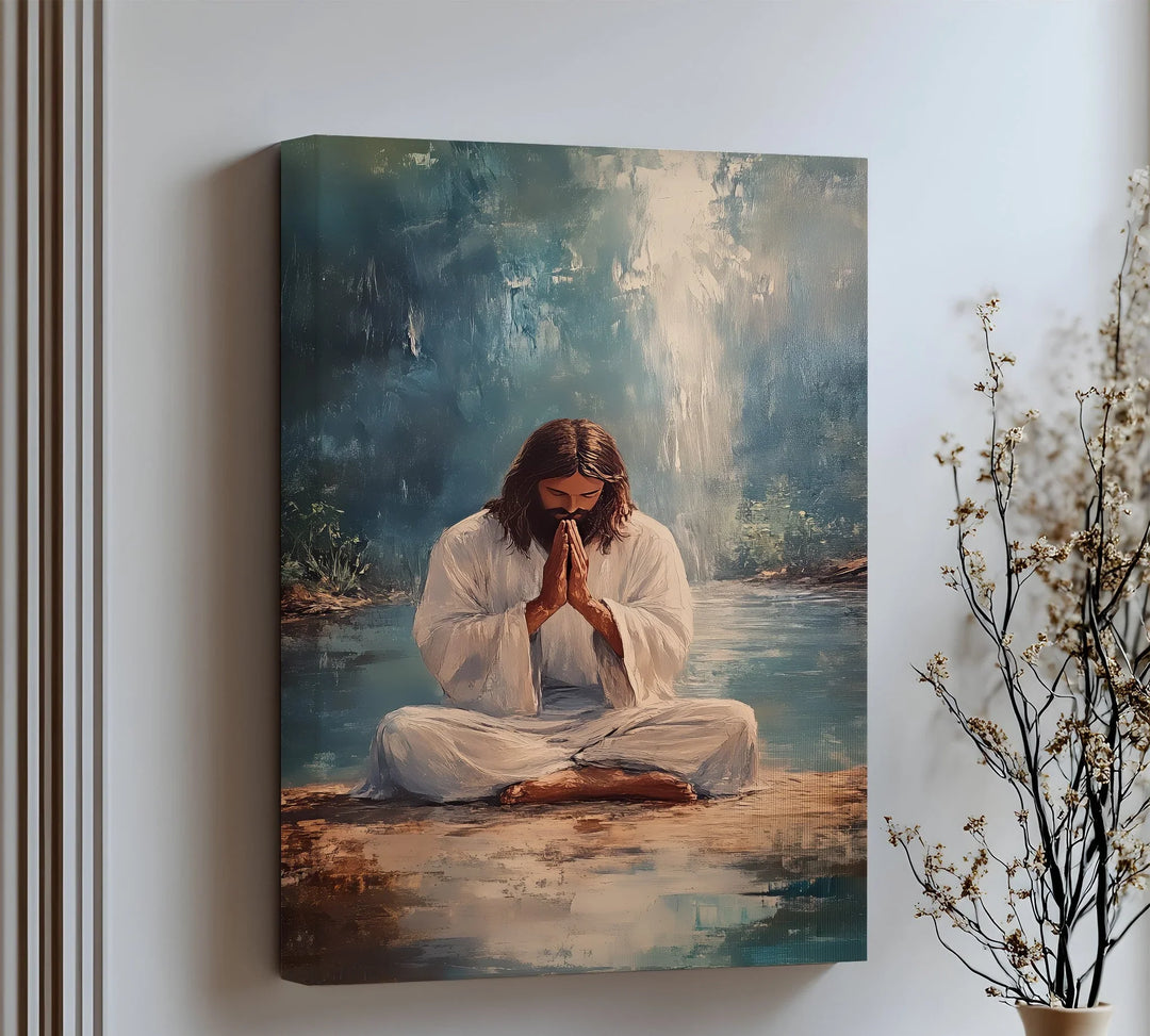 Invite calm and reverence into your home with this peaceful canvas wall art of Jesus in prayer by the water.

