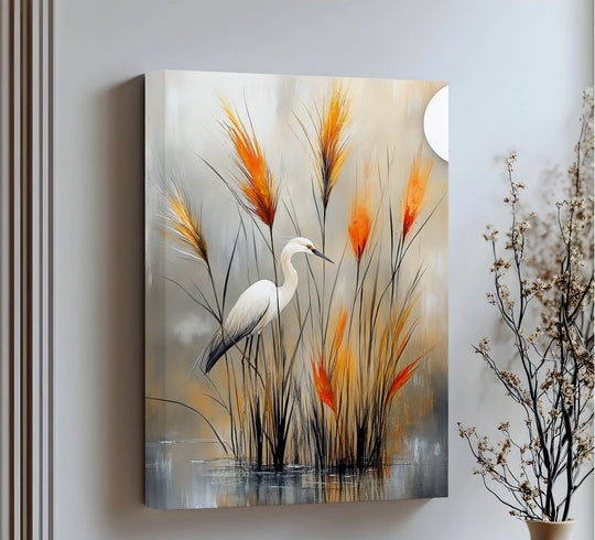 Softly blurred reflections ripple beneath the marsh grasses on this fine art canvas wall decor featuring a poised white heron amidst fiery crimson reeds.