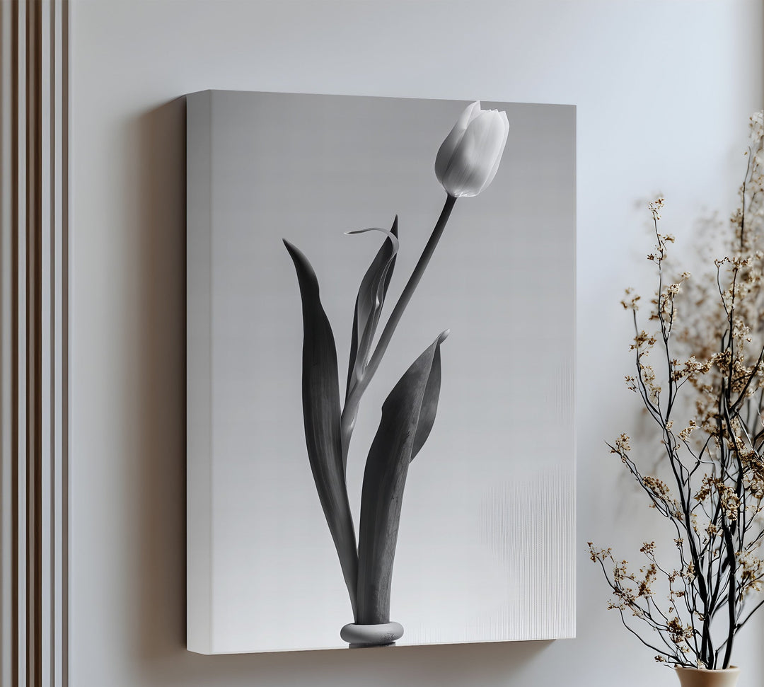 Gracefully minimal, this canvas wall art features a tall tulip silhouette for modern elegance.

