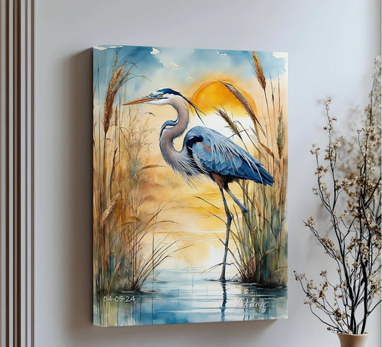 Subtle light and shadow enhance the tranquil canvas wall decor of a blue heron standing gracefully amidst sunlit reeds at sunset, reflected in the still water.