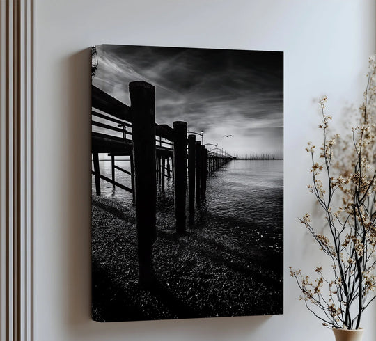 Geometric posts form a repeating linear rhythm in this black and white Midnight Pier premium canvas decor print.