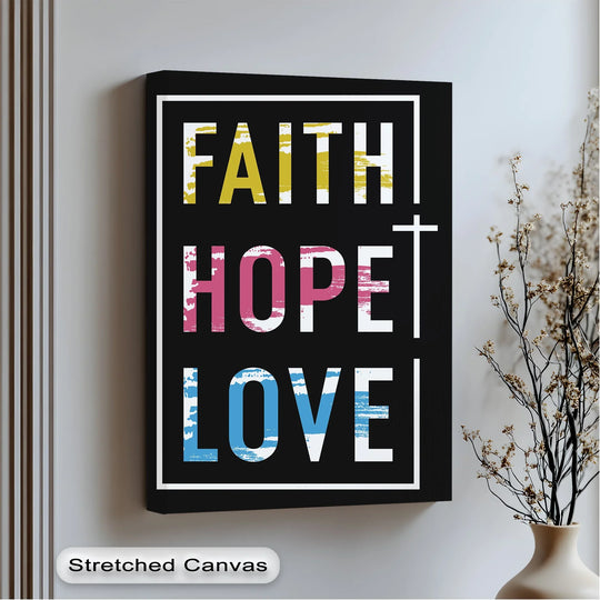 Subtle light and shadow highlight the bold lettering of the Faith Hope Love canvas art print, creating depth within its simple, modern design.