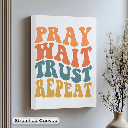 Echoing a rhythmic repetition, the 'Pray Wait Trust Repeat' canvas wall art features bold typography creating a sense of motion.