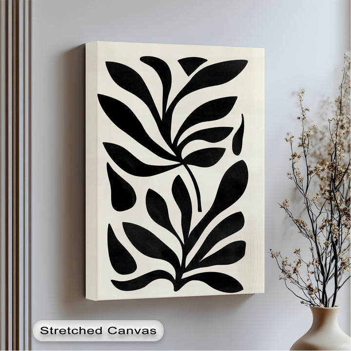 Organic forms create a captivating, minimalist design in this black botanical wall art, a striking example of a unique canvas print with abstract leaf shapes.