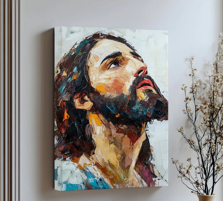 Feel inspired by this expressive canvas wall art capturing Christ’s upward gaze of divine connection.


