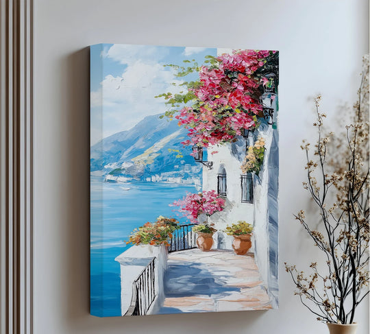 Illuminated by sunlight, the beautiful floral canvas wall decor of a sunlit balcony overlooking the Amalfi coast brings seaside charm to any room.