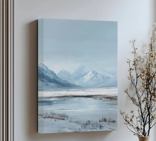 Cool blues dominate this serene mountain landscape canvas wall art print, showcasing silent, snowy peaks in a calming and minimalist design.