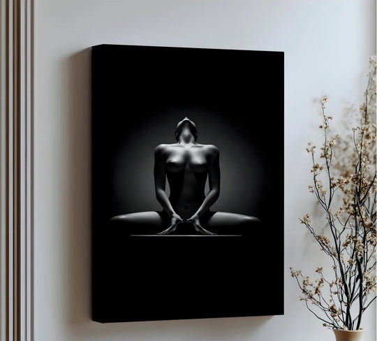 Undulating light dances across the black and white female form of this framed canvas print, creating a sense of movement and life in the sculpted shadows.