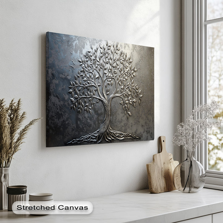 The layering effect shows the silver tree's intricate design raised from its textured dark background, making it a best canvas prints.