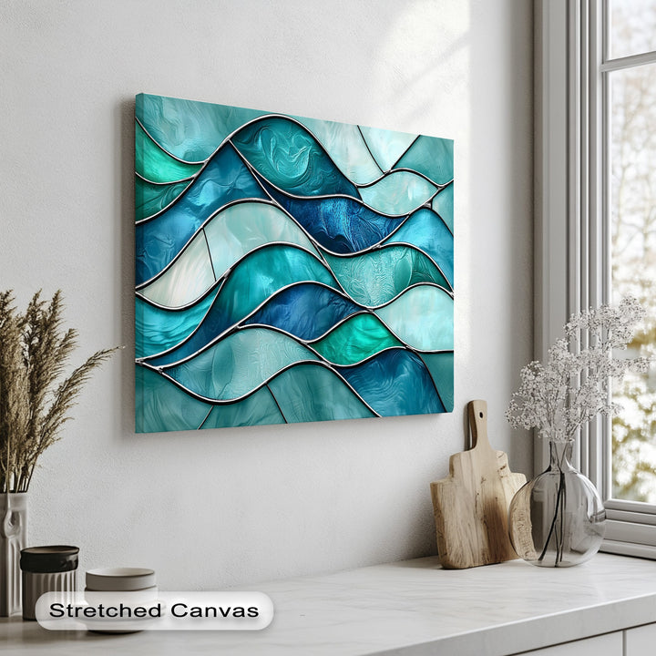 Deep, layered turquoise wave canvas art prints showcase an intricate stained glass ocean design, featuring lustrous blue and teal panels.