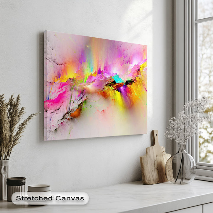 The vibrant mood of the room is uplifted by a dynamic hanging canvas featuring a colorful abstract burst.