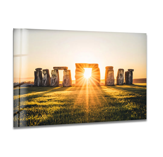Brilliant color contrast highlights the sunburst through the stones in this Stonehenge sunrise monument, a stunning glass art painting.