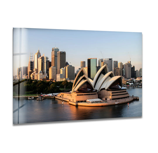 Reflecting light dances across the smooth surface texture of this Sydney Opera House glass wall art, showcasing the depth and clarity achieved through high-quality glass printing.