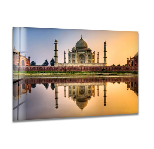 The Taj Mahal, the central subject in the glass wall art, offers unique modern wall decor with a majestic reflection showcasing India's iconic landmark.