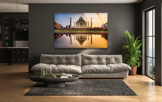 Majestic Taj Mahal reflecting in water serves as the focal point for this stunning glass wall art prints piece, showcasing India's iconic landmark.
