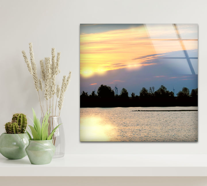 Sunset Lake View Wall Art – Serene Wind Turbine Glass Print for Eco-Inspired and Modern Interiors