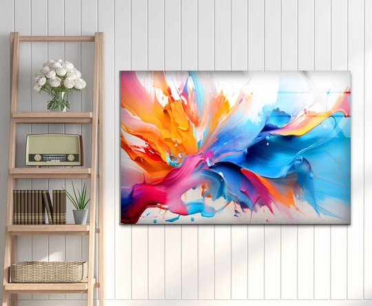 Abstract decorative wall art featuring dynamic, angular splashes of vivid pink, orange, and blue.