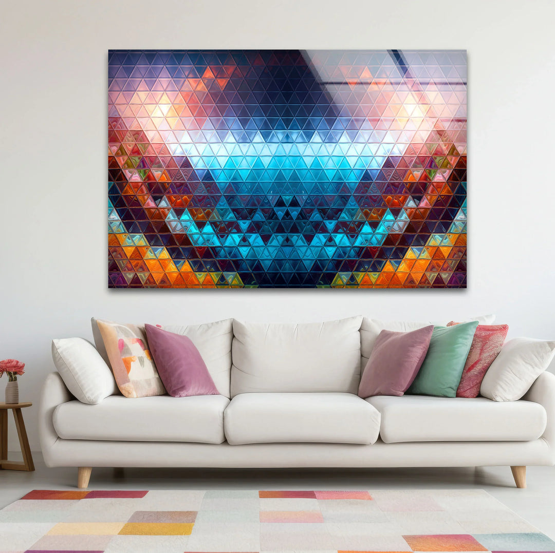 Negative space surrounds the geometric prism glass wall art, highlighting its colorful triangle mosaic pattern created by precision glass printing.