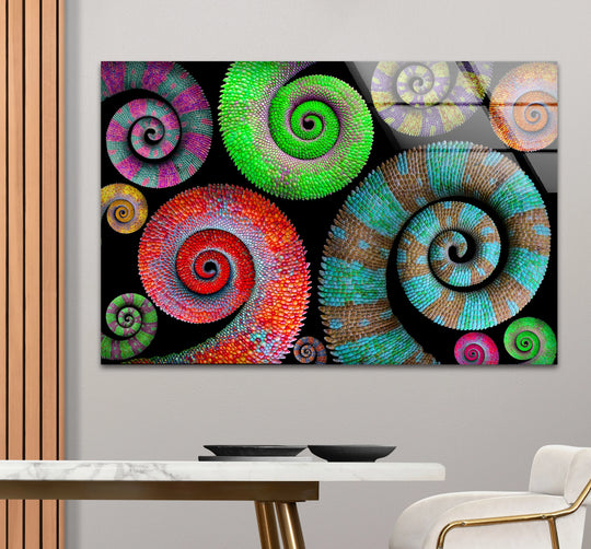Cool and warm colors blend in this vibrant glass art featuring a spiral pattern.