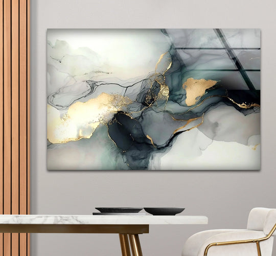 Minimalist gold ink wall art featuring fluid abstract strokes on the clean edge of glass art.