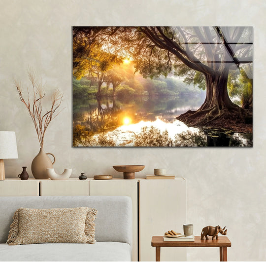 Organic forms define this golden forest sunrise reflections glass wall art, where the tree's majestic silhouette and river's tranquil surface highlight the beauty of glass printing.