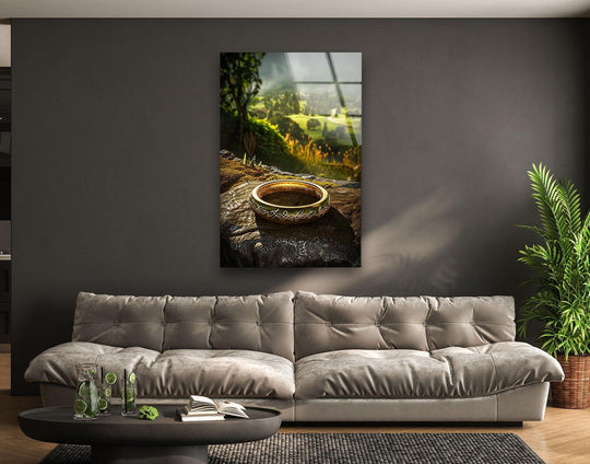 Hyperrealistic mystic golden ring in this landscape glass decorative wall art showcases intricate details on a textured stone against a hazy green valley.
