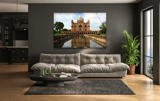 Juxtaposing dark walls with a light sofa, this color contrast highlights the Humayun's Tomb glass wall artwork, accentuating the iconic Mughal landmark's reflection.
