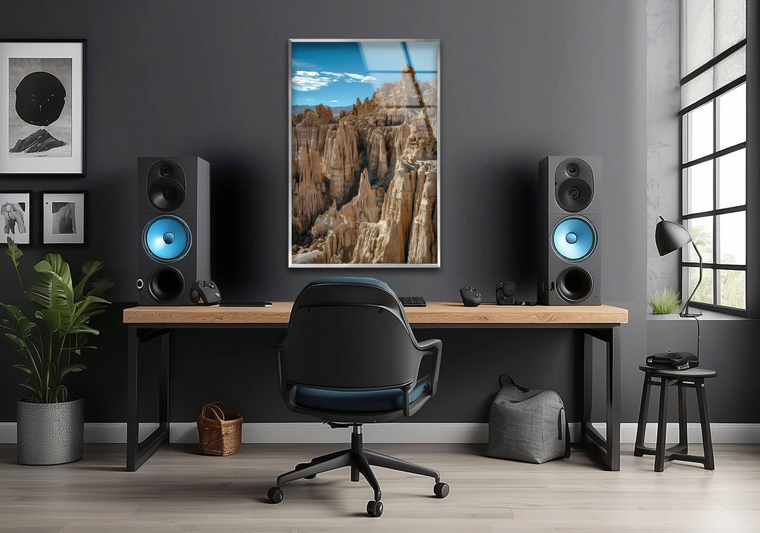 8K glass print of towering rock spires in a dramatic desert scene.
