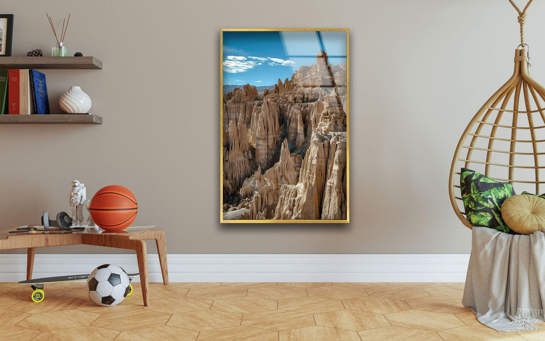 Desert-inspired glass wall decor with rugged canyon cliffs and deep ridges.
