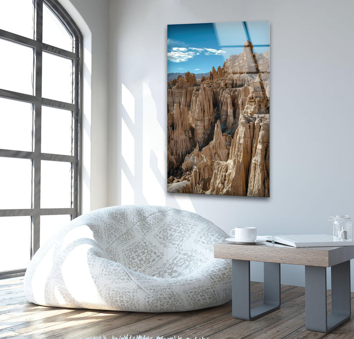 High-quality glass print of majestic desert rock formations under a clear sky.
