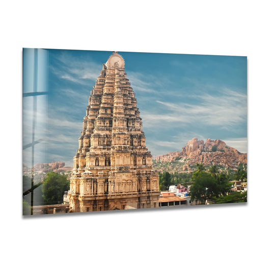 Captured with rich color saturation, the Virupaksha Temple glass wall art decor presents a majestic view of Hampi's iconic ancient temple.